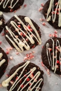 chocolate cookie drizzled with marshmallow creme and sprinkled with crushed peppermint