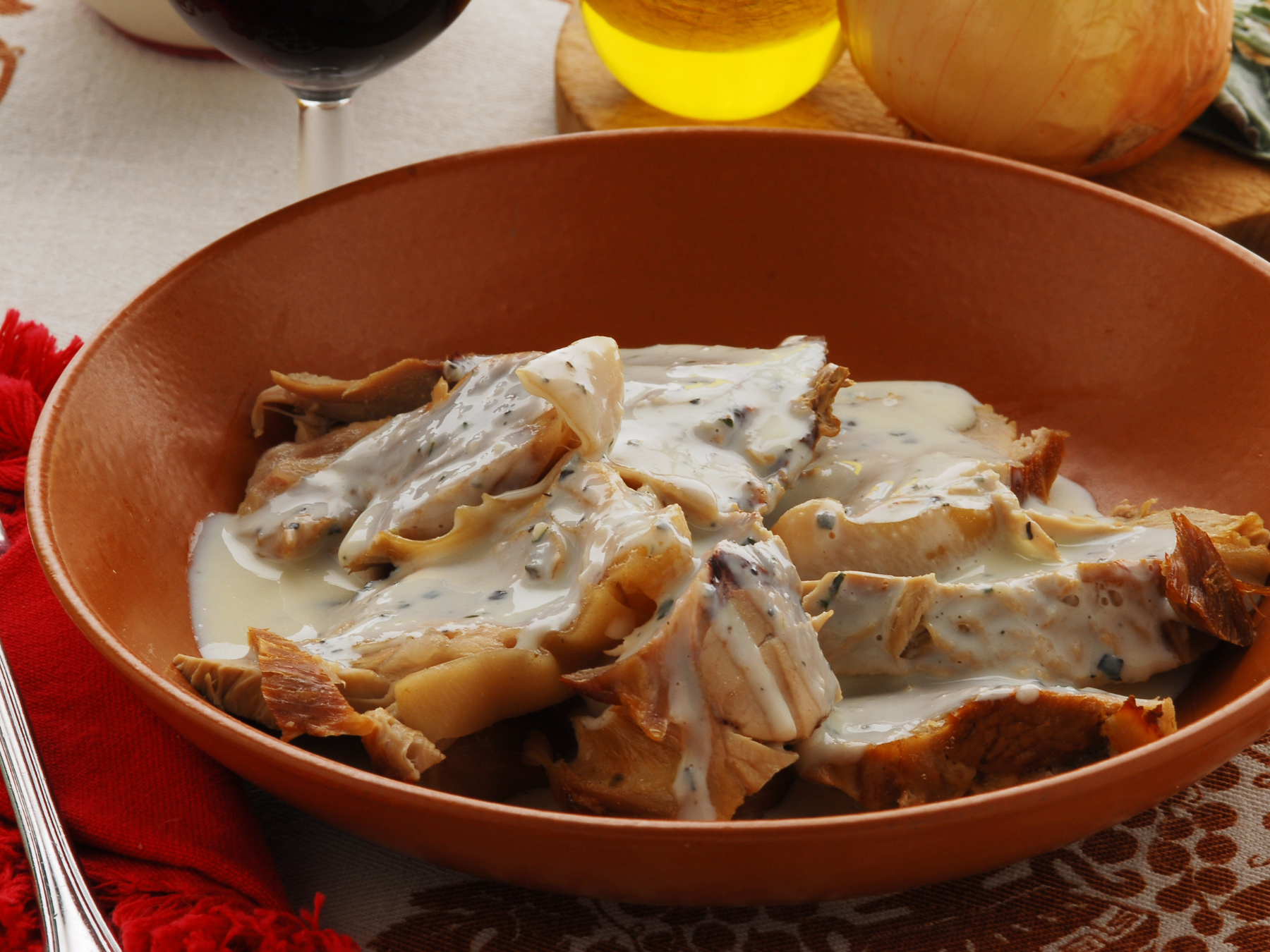 A bowl of sliced pork loin smothered in a browned milk gravy. A recipe from Italy called Maiale Al Latte